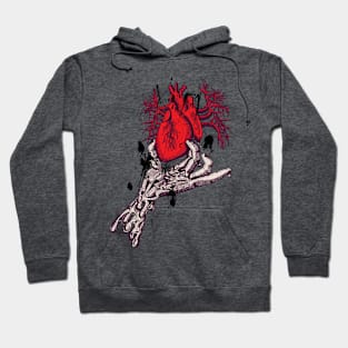 Skeleton hand holding anatomical red heart Hoodie